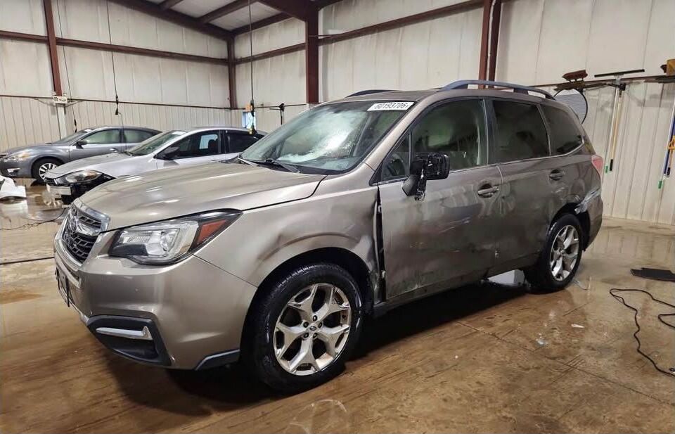 Tan 2017 Subaru Forester 2.5i Touring being parted out